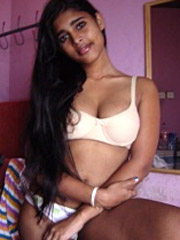 Hot amateur pics of stunning indian cutie in white undies posing.