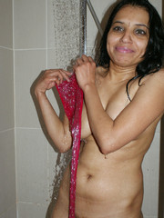 Wild indian chick in a red shawl taking shower