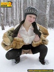 Cute white teen in fur coat, shirt and pantyhose takes an piss in the snow